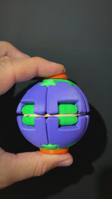 Twist Orb spinning fidget ball: pinch the caps, spin, it opens up and folds back